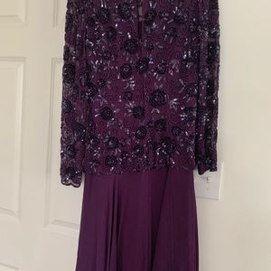 Gorgeous eggplant color tea length dress.  Long sleeves with gorgeous sequins.